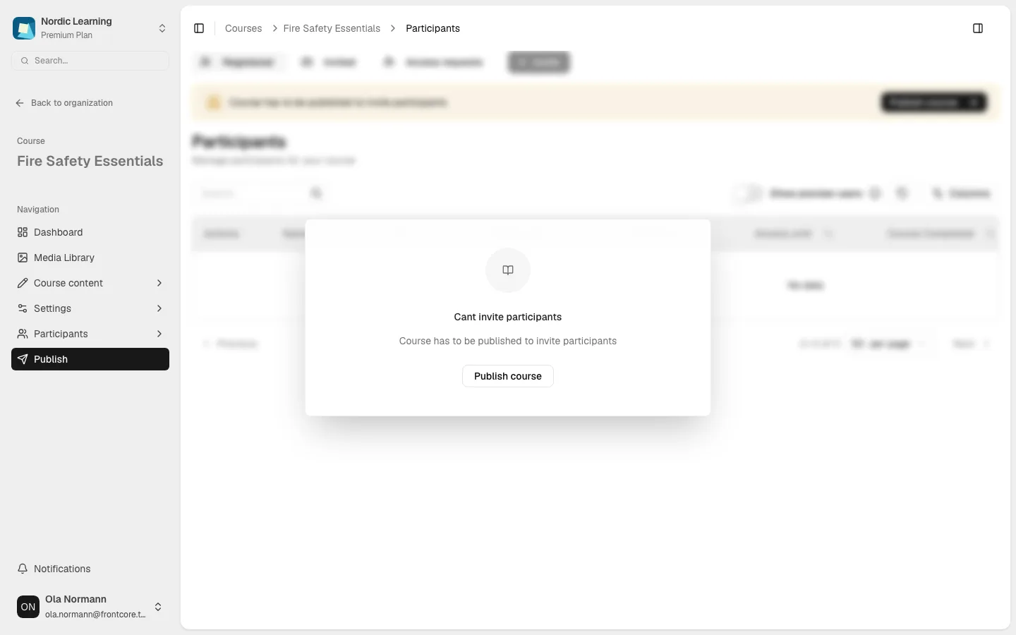 Participants page on an unpublished course, showing the blurred table behind a Cant invite participants alert and a Publish course button